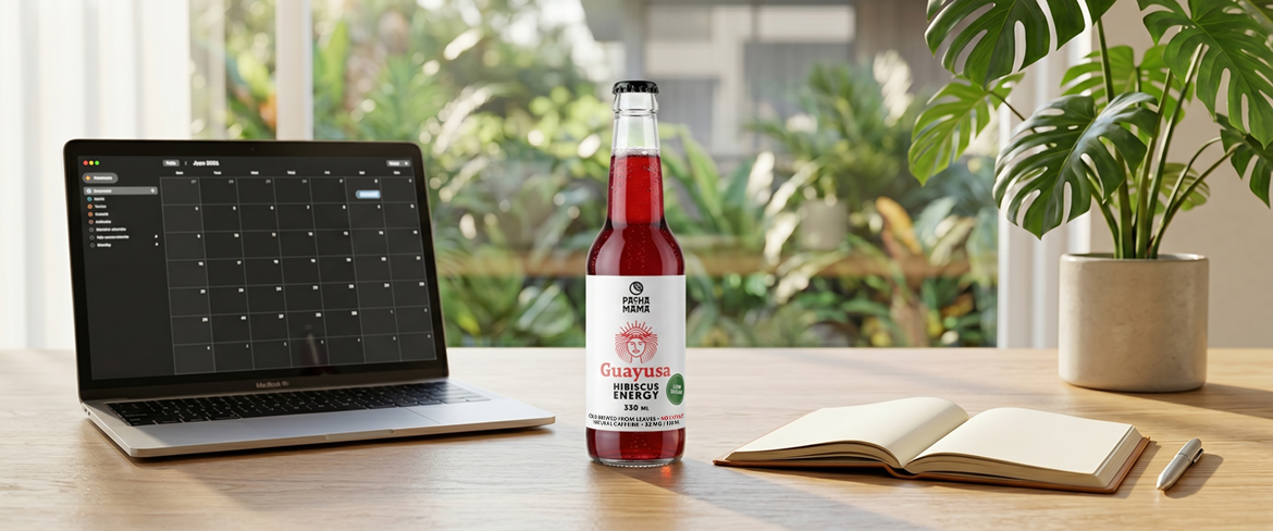 Guayusa in a bottle beside a laptop on a desk – a convenient guayusa drink for focus at work.